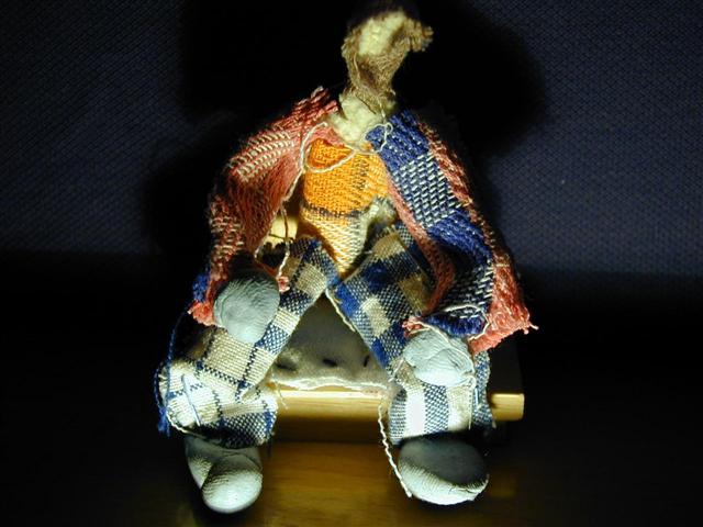 man on cushion in his old clothes